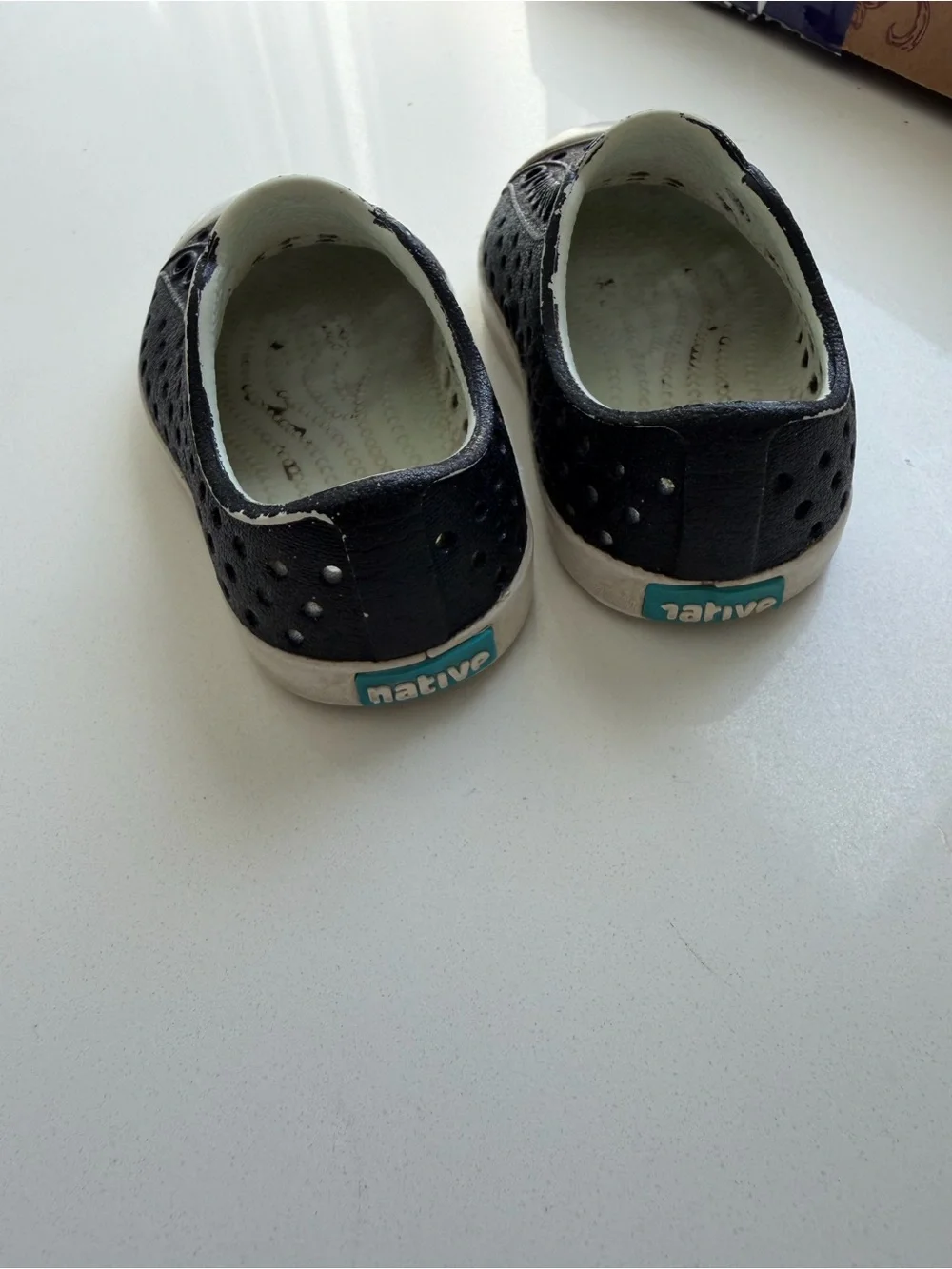 Native Kids Black Slip-On Water Shoes with White Soles and Teal Logo